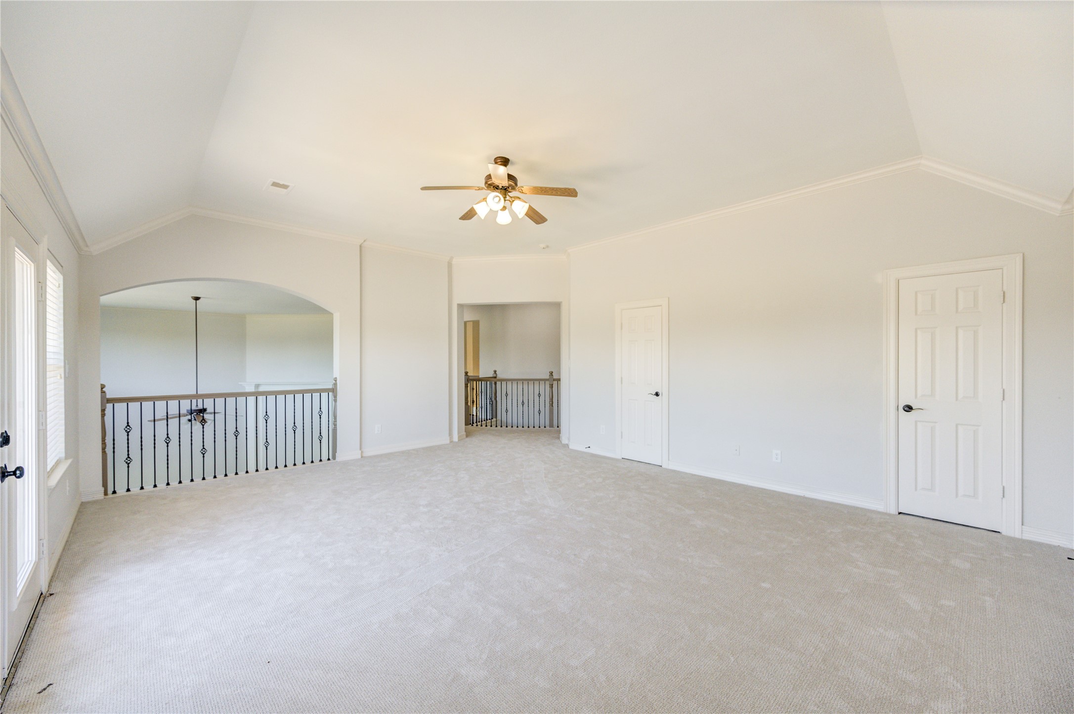 3007 Mullingar Walk Missouri City, TX 77459 - Photo 47 of 49 an empty room with chandelier fan and windows