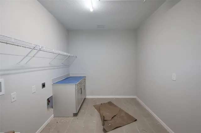 a view of storage and utility room with empty racks