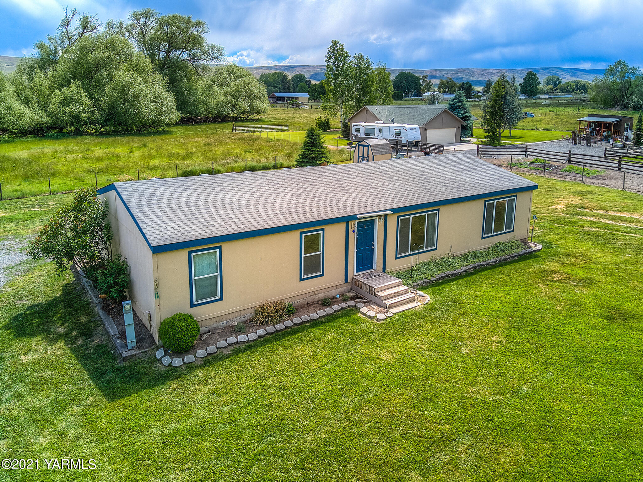 10204 Meadowbrook Road Yakima, WA 98903 - Photo 2 of 29 a aerial view of a house with a yard table and chairs