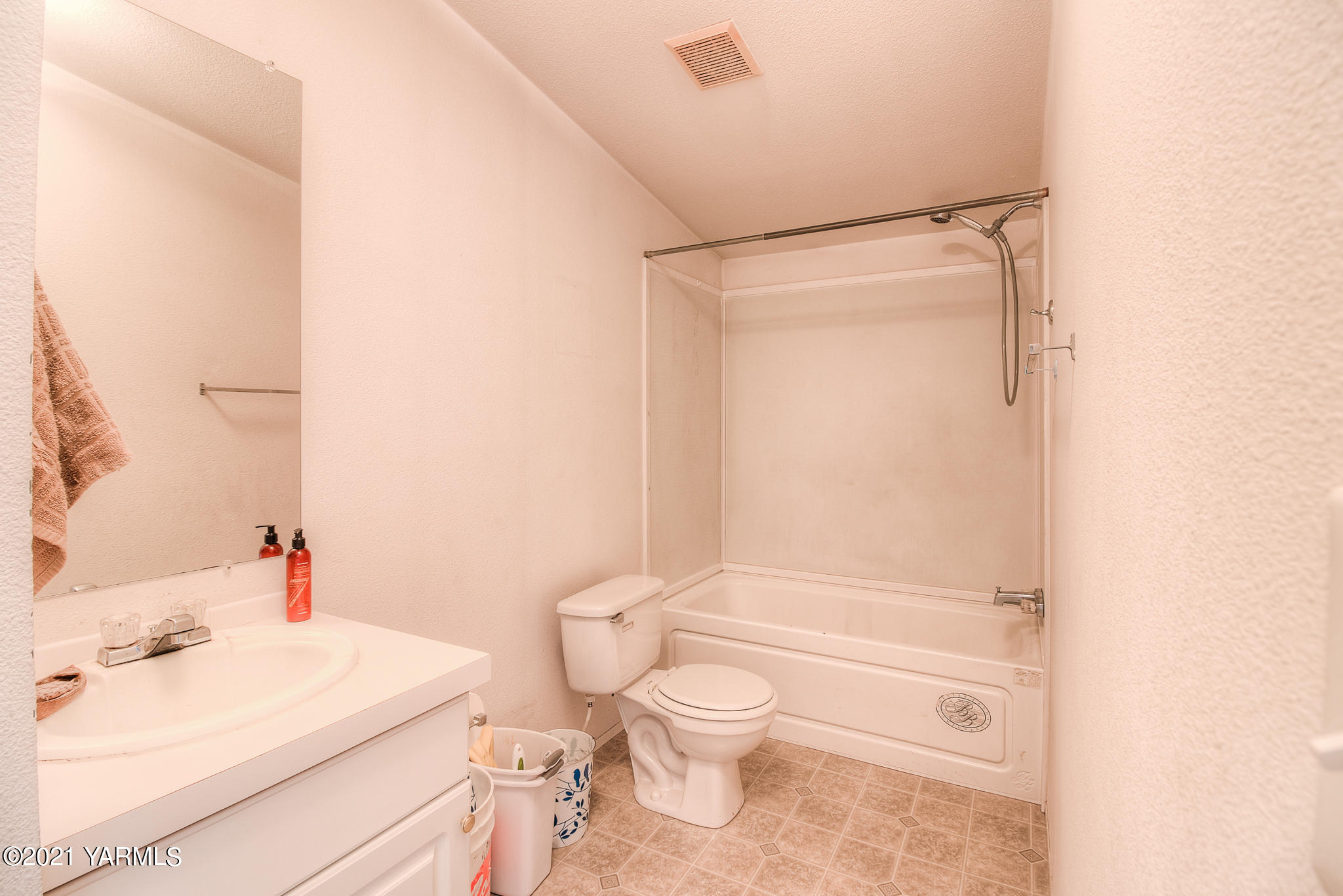 10204 Meadowbrook Road Yakima, WA 98903 - Photo 17 of 29 a bathroom with a sink a toilet and shower