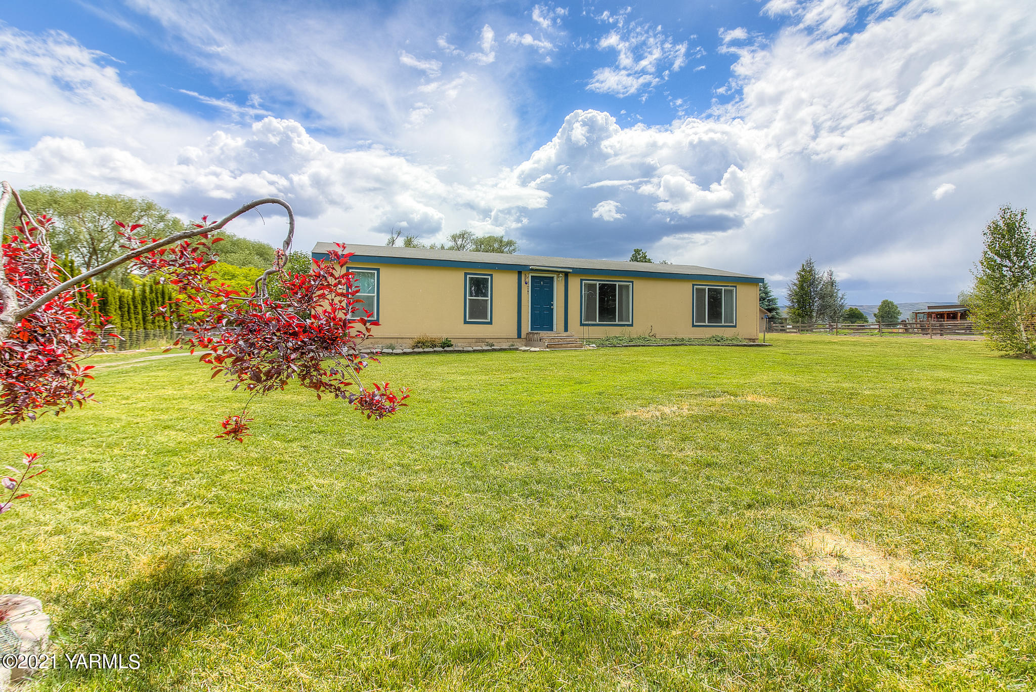 10204 Meadowbrook Road Yakima, WA 98903 - Photo 21 of 29 a view of a house with a big yard and potted plants