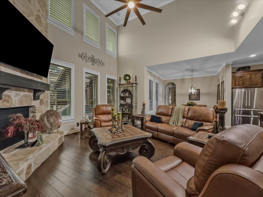 2832 Mona Vale Road Trophy Club, TX 76262 - Photo 4 of 37 a living room with furniture ceiling fan and a fireplace