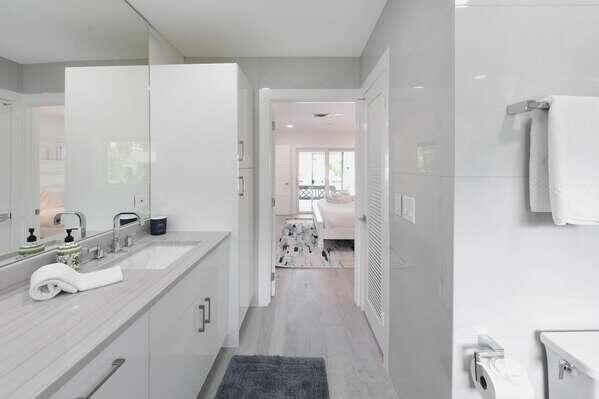 839 Enfield Street Boca Raton, FL 33487 - Photo 12 of 36 a spacious bathroom with a sink a mirror and shower