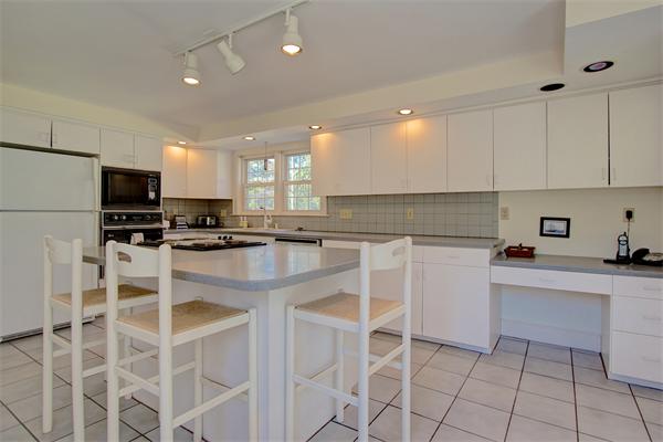 110 Belknap Road Framingham, MA 01701 - Photo 15 of 30 a kitchen with cabinets appliances and a counter top space