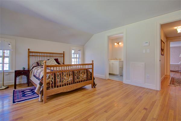 110 Belknap Road Framingham, MA 01701 - Photo 17 of 30 a bedroom with furniture and a wooden floor