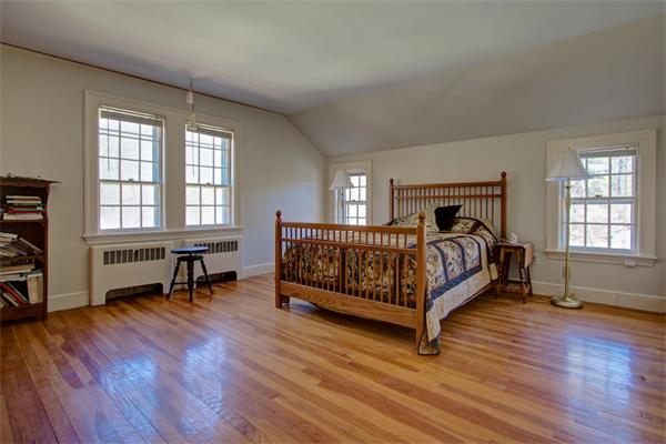 110 Belknap Road Framingham, MA 01701 - Photo 18 of 30 a bed room with a bed and a chair