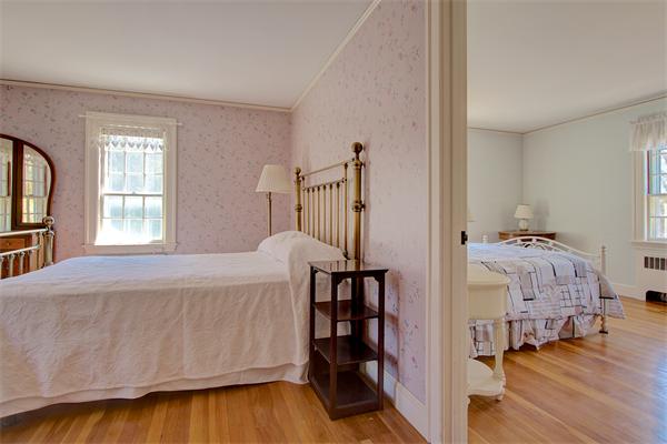 110 Belknap Road Framingham, MA 01701 - Photo 23 of 30 a bedroom with a bed and a book shelf