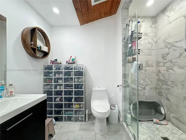 a bathroom with a toilet and a sink