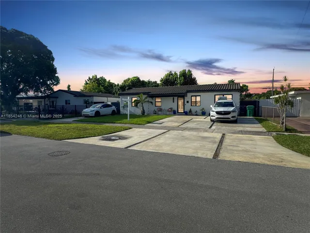 a view of a house with outdoor space and sitting area
