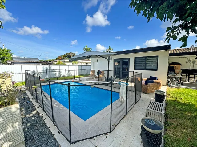 a view of a living room and patio