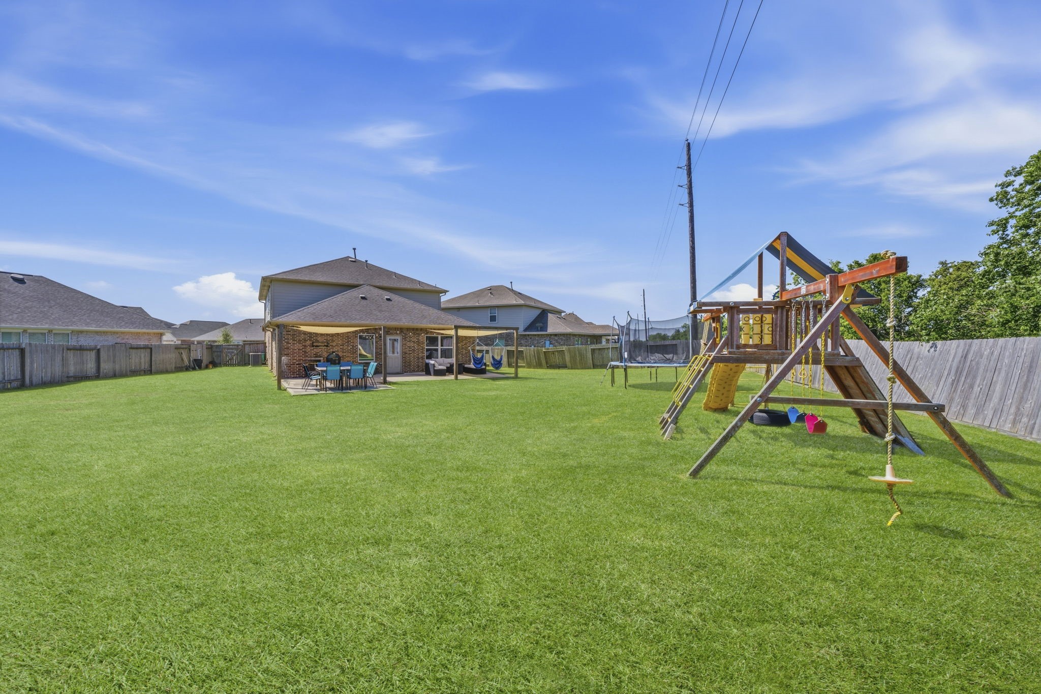 2401 Abbot Brk Drive Rosharon, TX 77583 - Photo 42 of 50 For added enjoyment and convenience, the children’s playset and trampoline are included with the home, making this backyard ready for fun from day one.