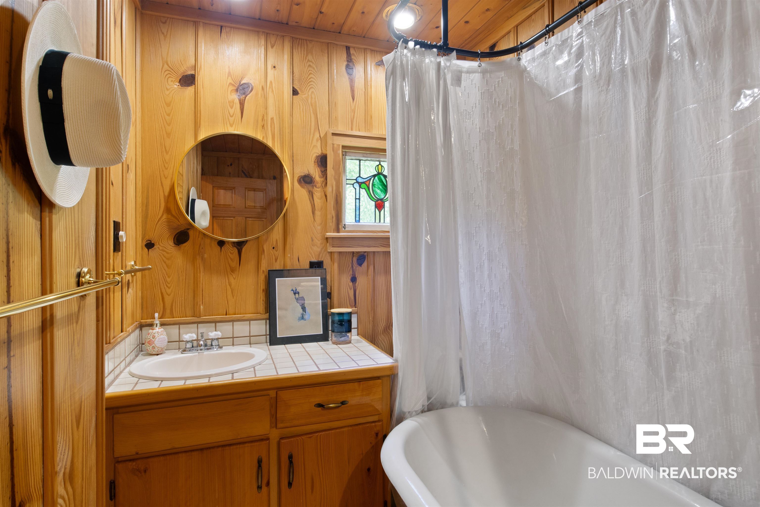 15100 Vasko Road Silverhill, AL 36576 - Photo 30 of 51 Enjoy the clawfoot tub or rain water shower in the guest cabin bath.