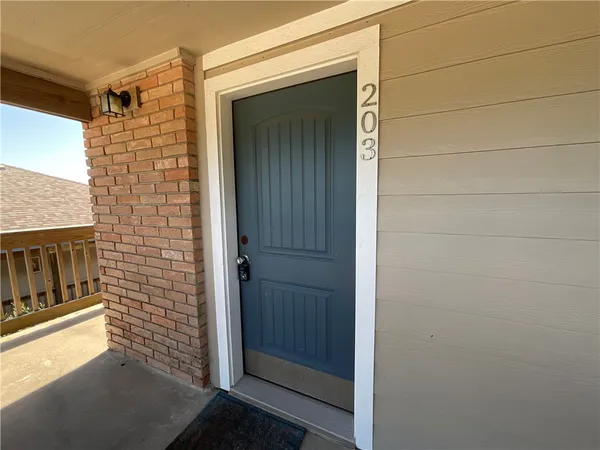 a view of a door and a window