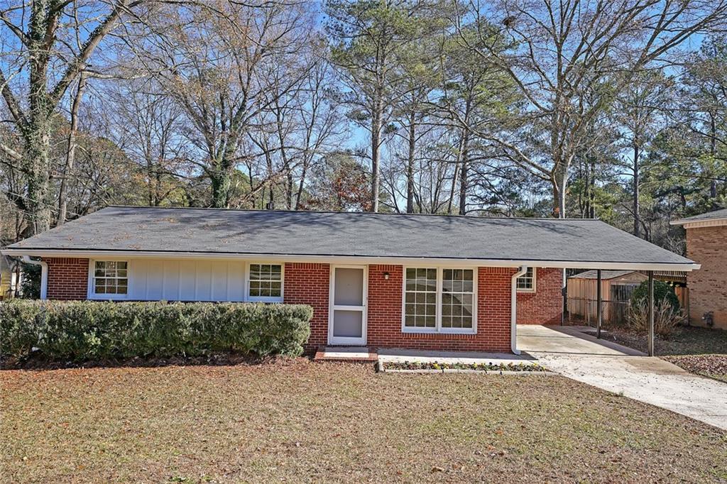 6472 Rabun Road Morrow, GA 30260 - Photo 1 of 1 a front view of a house with a garden