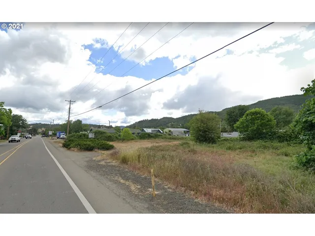a view of a street with an ocean view