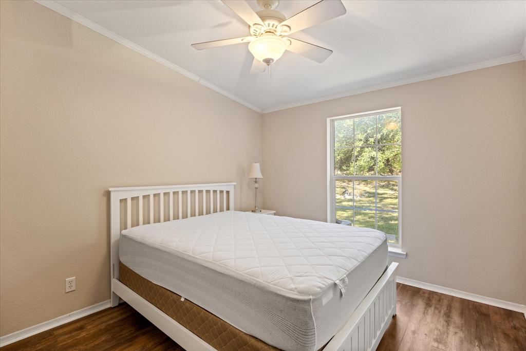 4474 South Fm 200 Nemo Nemo, TX 76070 - Photo 18 of 40 a bed sitting in a bedroom next to a window