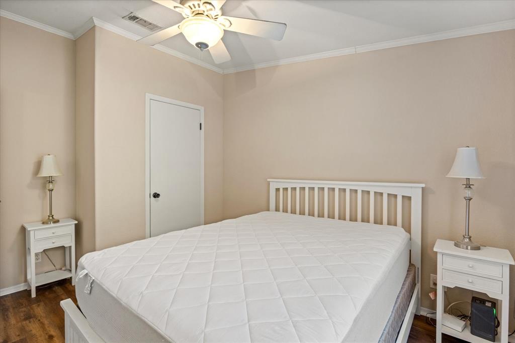 4474 South Fm 200 Nemo Nemo, TX 76070 - Photo 19 of 40 a large bed sitting in a bedroom and a chandelier