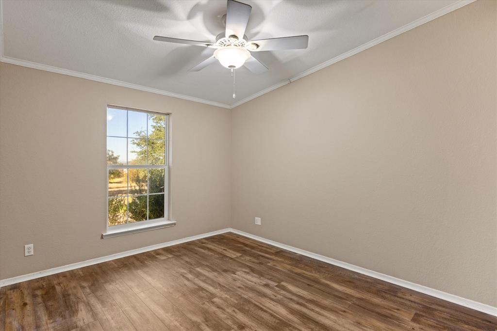4474 South Fm 200 Nemo Nemo, TX 76070 - Photo 23 of 40 an empty room with a window and a fan
