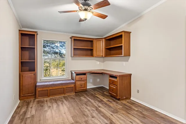 a view of livingroom with hardwood floor and a ceiling fan