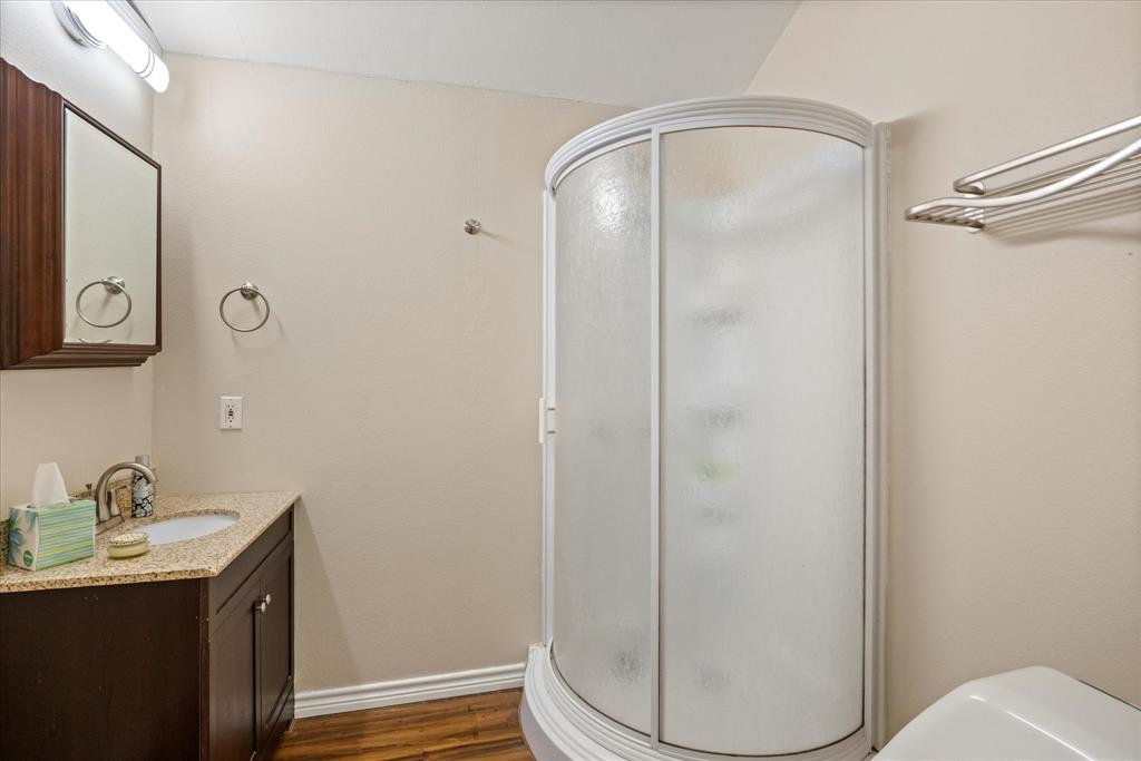 4474 South Fm 200 Nemo Nemo, TX 76070 - Photo 33 of 40 a bathroom with a granite countertop sink toilet and shower