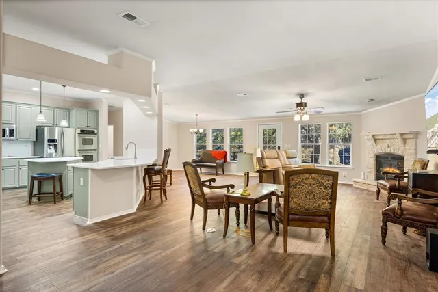 a view of a dining room with furniture kitchen and chandelier