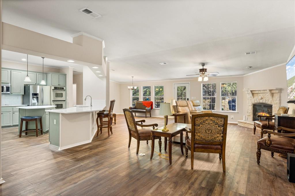 4474 South Fm 200 Nemo Nemo, TX 76070 - Photo 5 of 40 a view of a dining room with furniture kitchen and chandelier