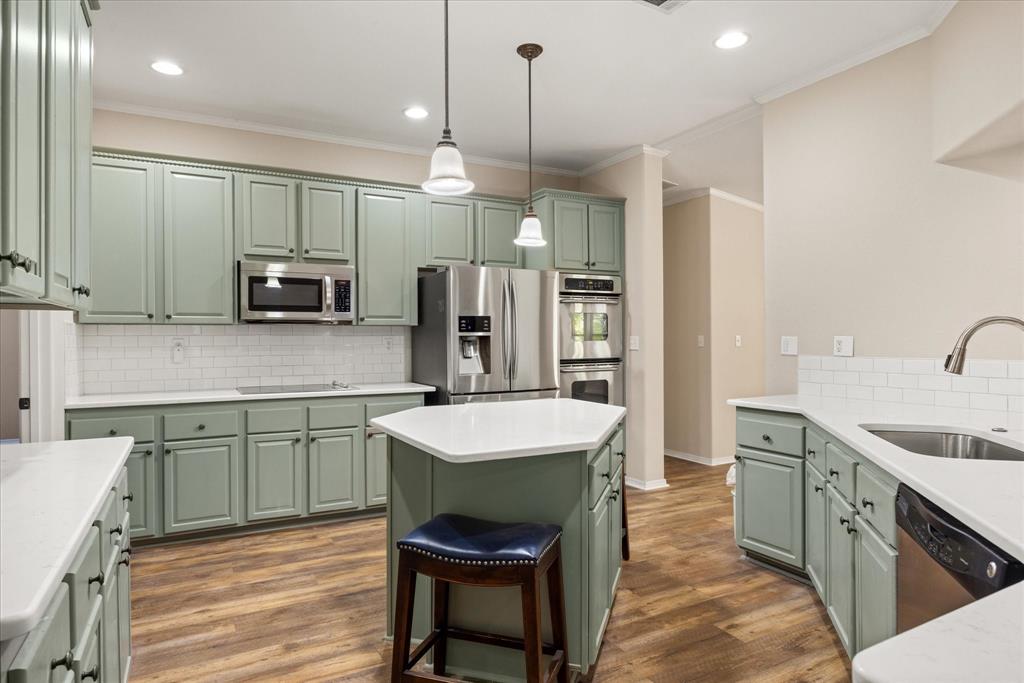 4474 South Fm 200 Nemo Nemo, TX 76070 - Photo 10 of 40 a kitchen with kitchen island a sink appliances and cabinets