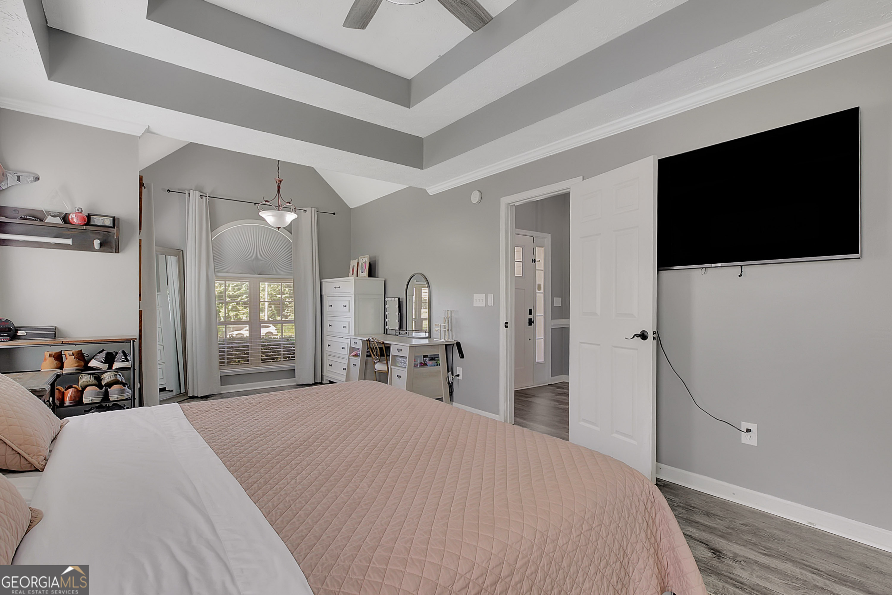 229 John Lovelace Road LaGrange, GA 30241 - Photo 14 of 59 a bedroom with a bed and a flat tv screen on wall