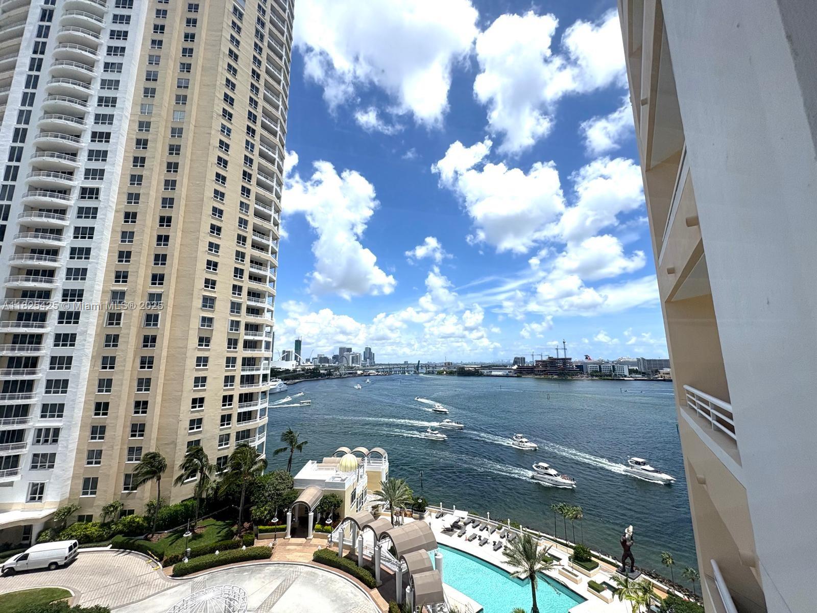 808 Brickell Key Drive, Unit 1103 Miami, FL 33131 - Photo 12 of 12 a terrace with outdoor seating and city view