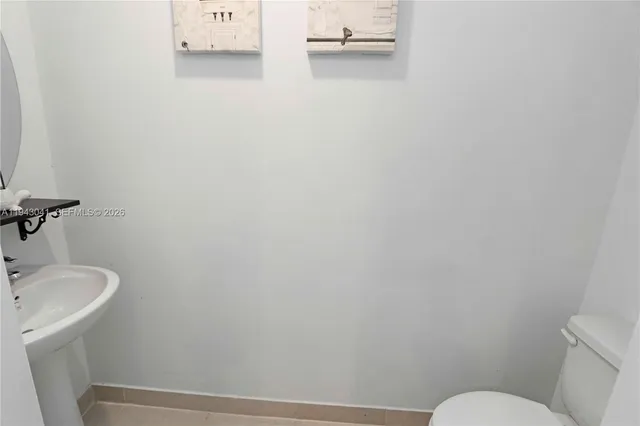 a bathroom with a sink and toilet