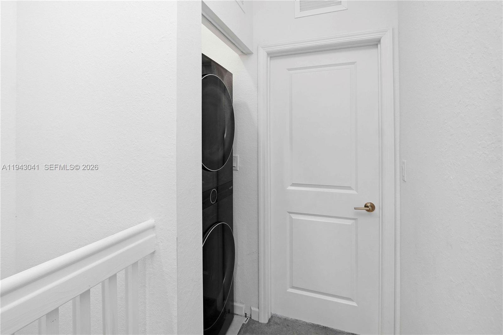 10125 Southwest 228th Terrace Miami, FL 33190 - Photo 16 of 26 a view of a utility room with washer and dryer