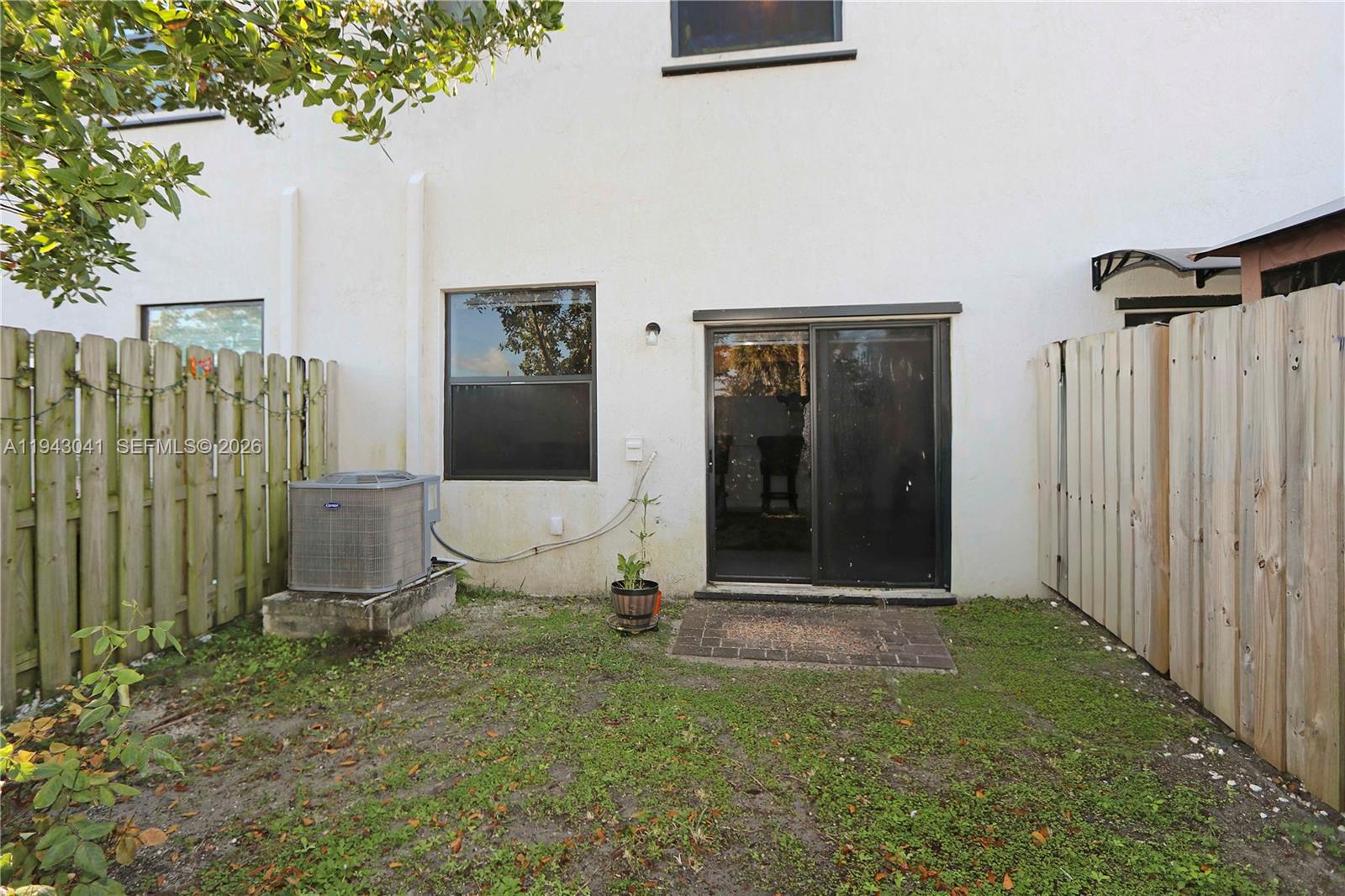 10125 Southwest 228th Terrace Miami, FL 33190 - Photo 24 of 26 a view of a front door and small yard