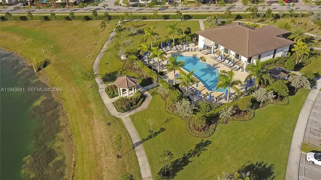 an aerial view of a house with a swimming pool