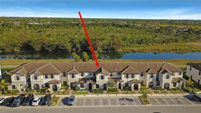 a view of multiple houses with a ocean