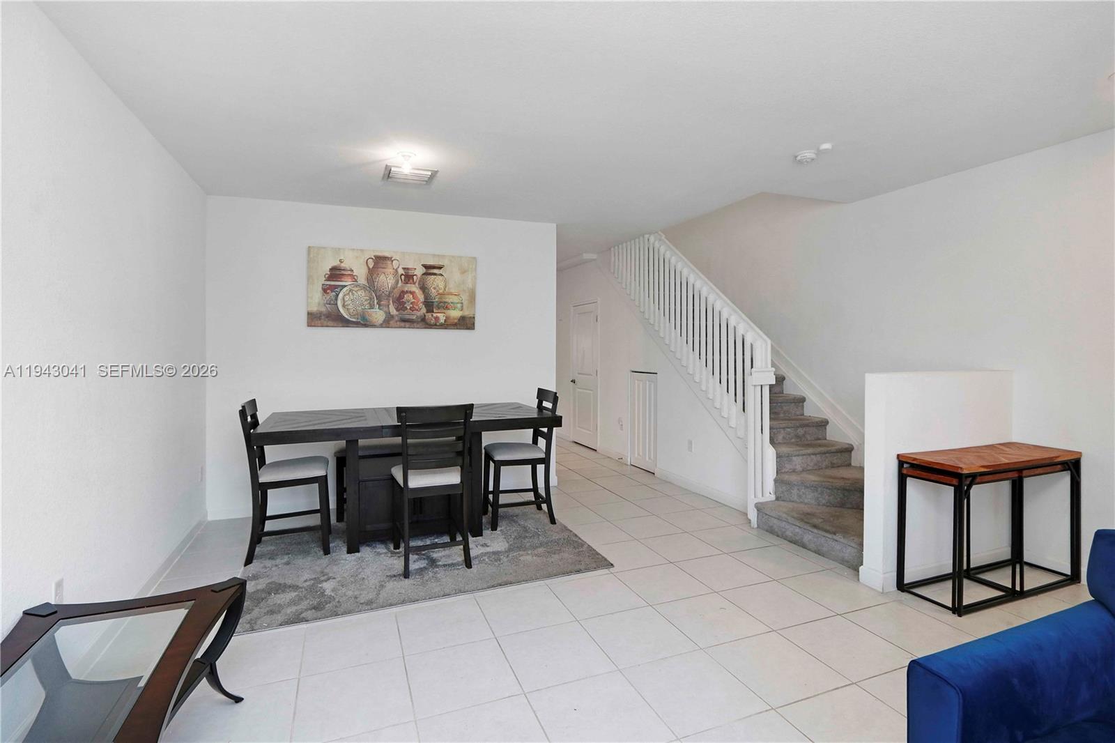 10125 Southwest 228th Terrace Miami, FL 33190 - Photo 6 of 26 a view of a workspace with furniture