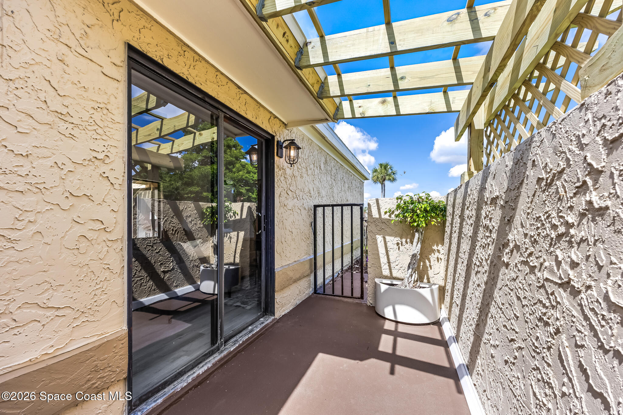 1411 Sheafe Avenue Northeast, Unit 101 Palm Bay, FL 32905 - Photo 17 of 24 a view of an entryway with wooden floor and door