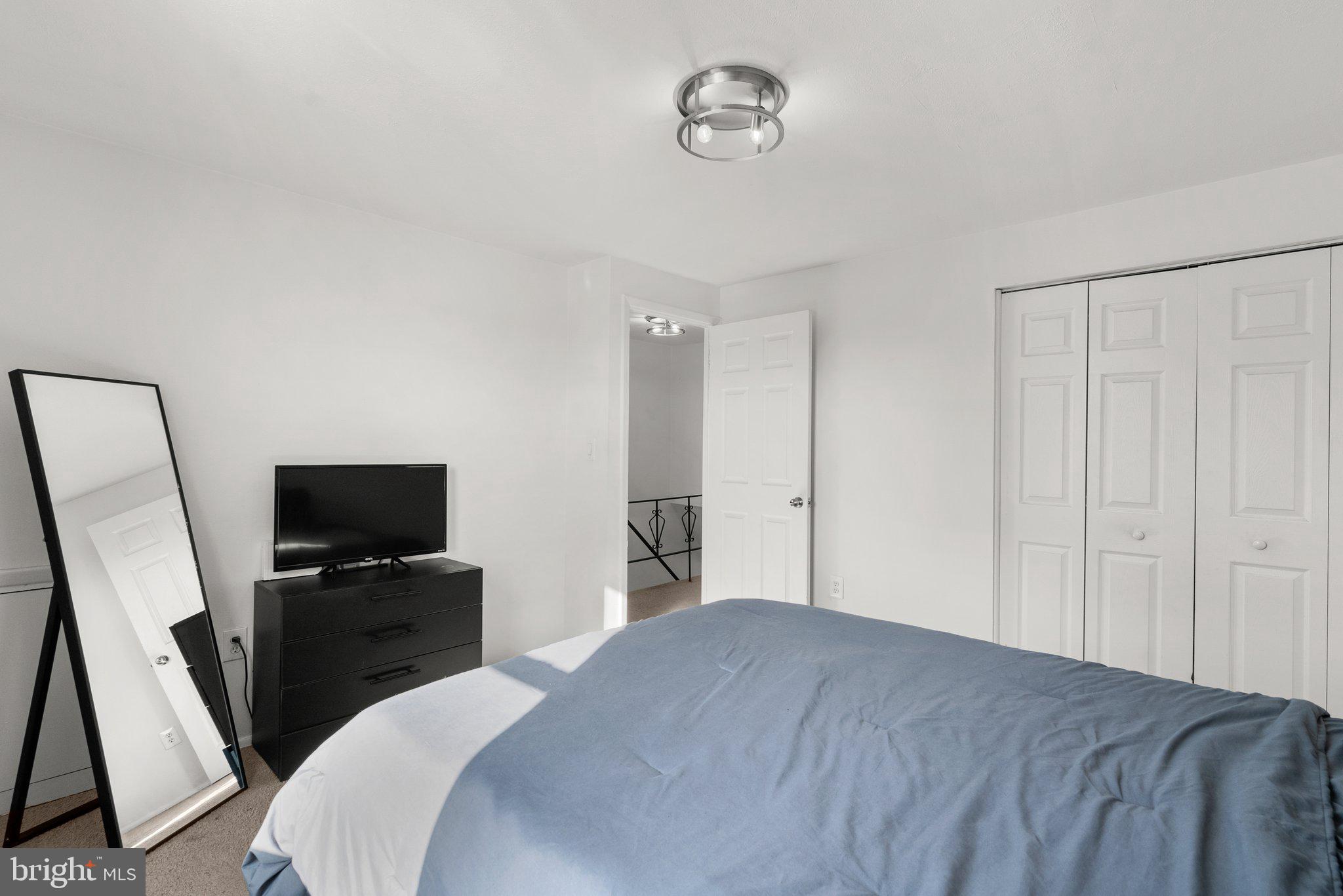 40 Bladen Road Baltimore, MD 21221 - Photo 20 of 44 a bedroom with a bed and a flat screen tv