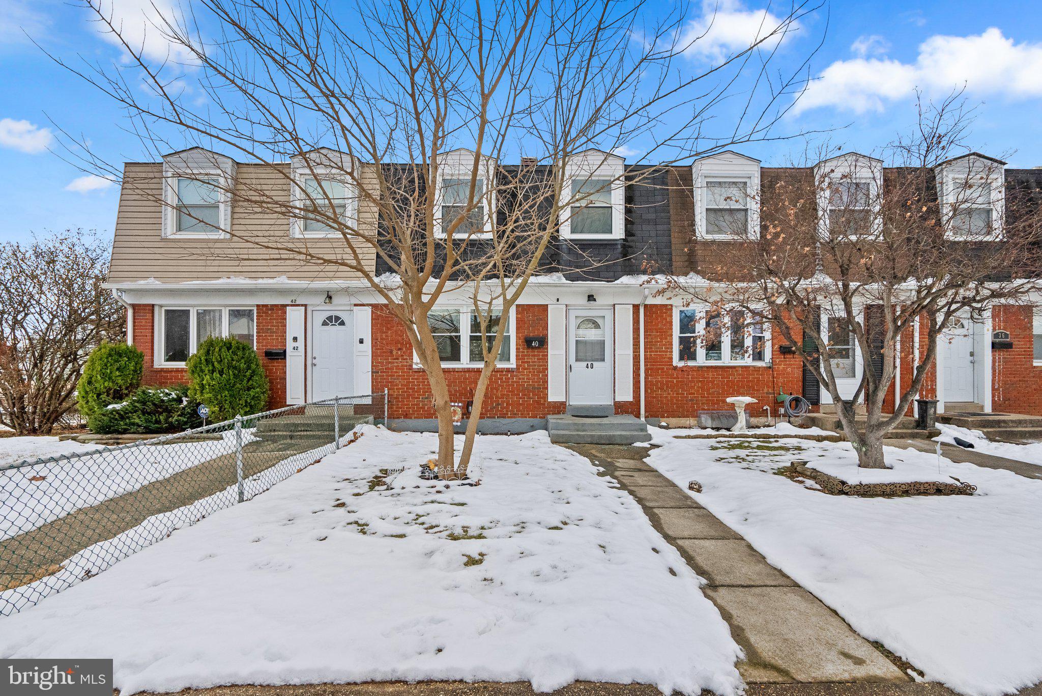 40 Bladen Road Baltimore, MD 21221 - Photo 2 of 44 a front view of a building with a bench