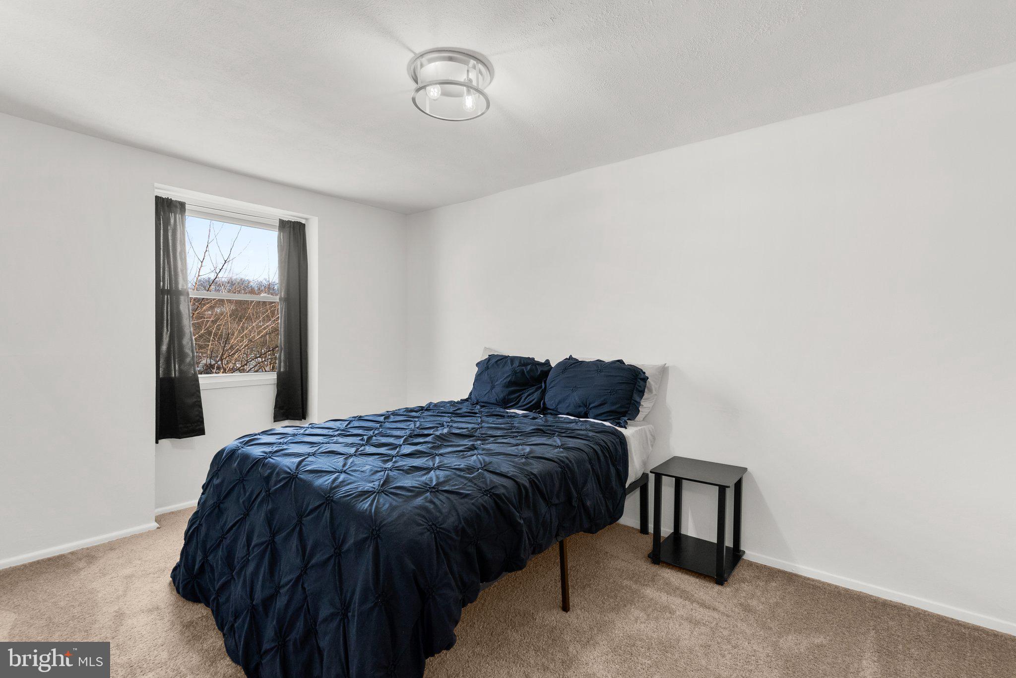 40 Bladen Road Baltimore, MD 21221 - Photo 22 of 44 a bedroom with a bed and a window