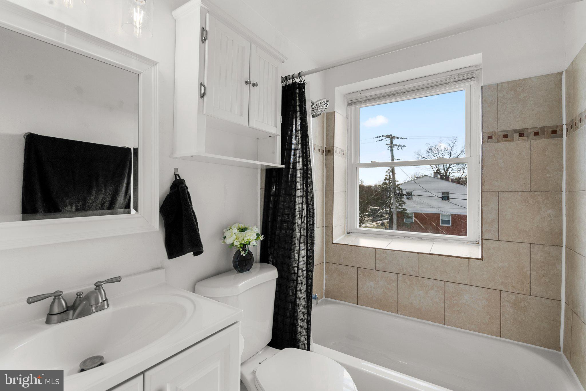 40 Bladen Road Baltimore, MD 21221 - Photo 26 of 44 a bathroom with a sink toilet and shower