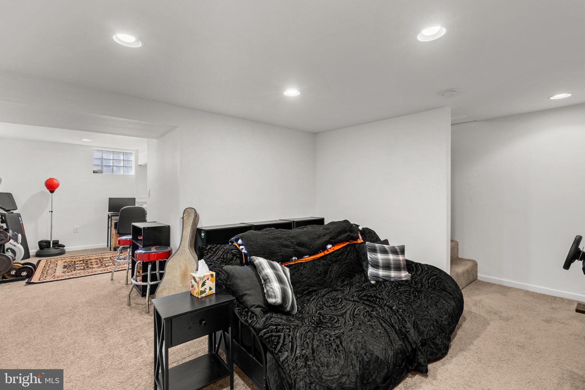 40 Bladen Road Baltimore, MD 21221 - Photo 29 of 44 a living room with furniture and a flat screen tv