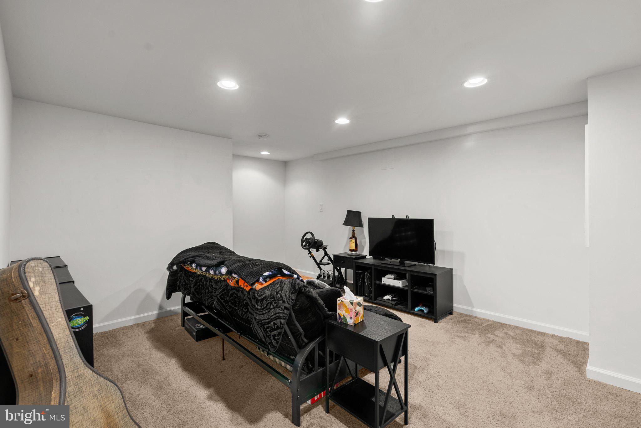 40 Bladen Road Baltimore, MD 21221 - Photo 31 of 44 a living room with furniture a flat screen tv and a window