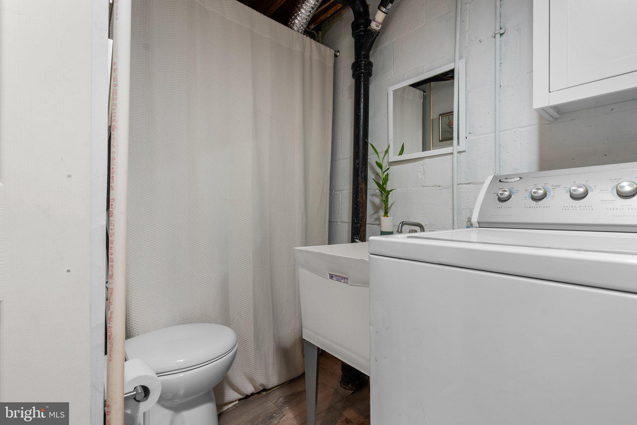 40 Bladen Road Baltimore, MD 21221 - Photo 36 of 44 a bathroom with a toilet and a sink