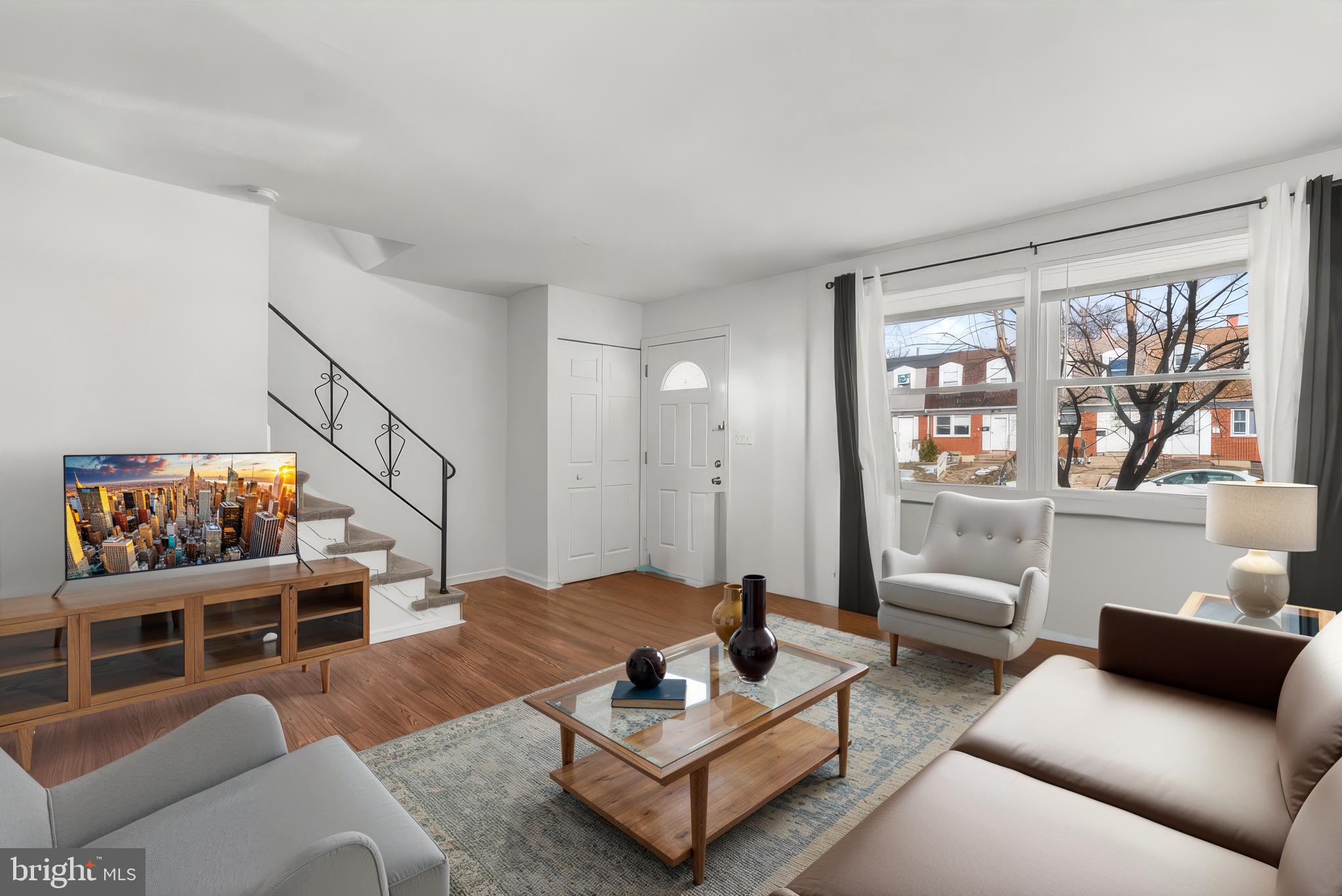 40 Bladen Road Baltimore, MD 21221 - Photo 6 of 44 a living room with furniture and a flat screen tv