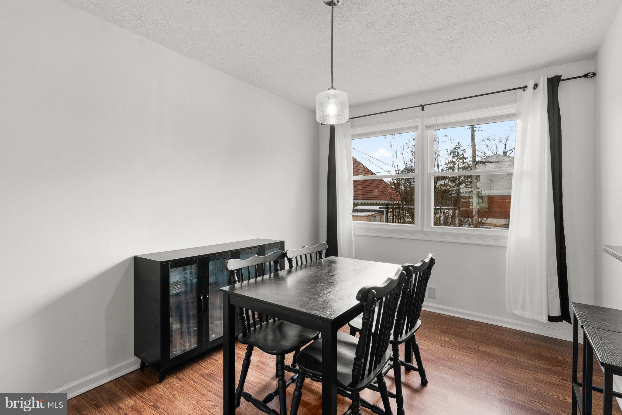 40 Bladen Road Baltimore, MD 21221 - Photo 9 of 44 a view of a dining room with furniture window and wooden floor