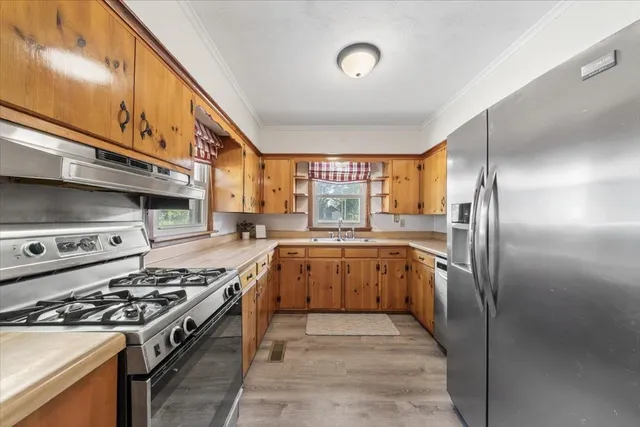 a kitchen with a stove and a refrigerator