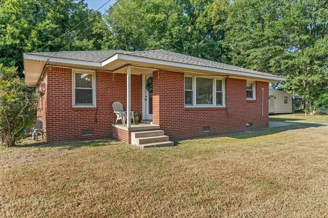 a front view of a house with yard