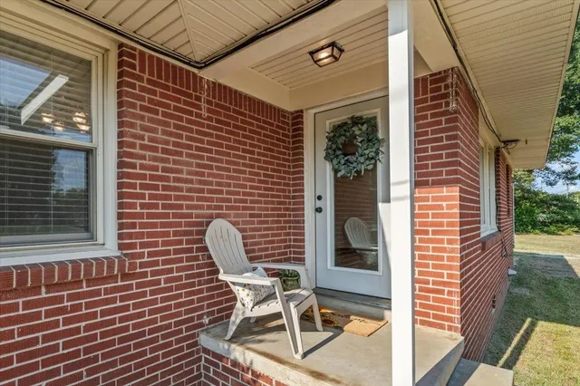 a view of a chair and table in the balcony