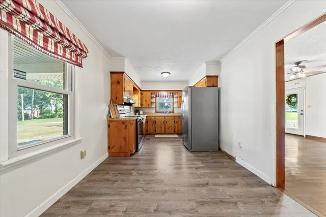a view of a kitchen with furniture and a window