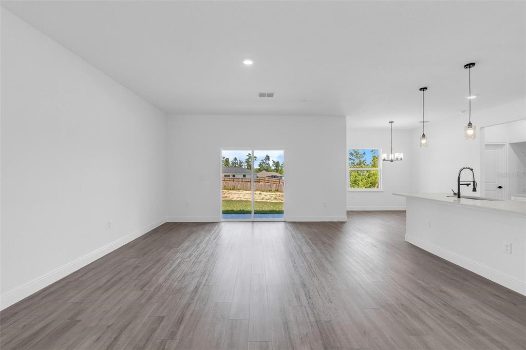 17109 Southwest 41st Circle Ocala, FL 34473 - Photo 24 of 72 a view of an empty room with window and wooden floor